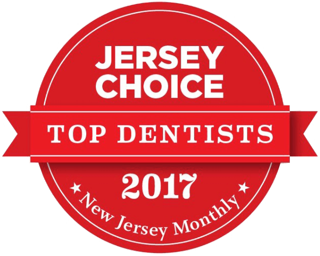 The image displays a red circular stamp-like emblem with text inside, which includes 'JERSEY CHOICE' at the top, followed by 'TOP DENTISTS 2017,' 'NEW JERSEY MONTHLY,' and a ribbon graphic with the text 'NJ MONTHLY.' Below this, there is a smaller inscription stating 'NJ MONTHLY'S TOP DENTISTS 2017' with a year indicator. The central part of the emblem features a white background with a red border and is labeled 'TOP DENTISTS 2017' in large, bold letters. The overall style of the image suggests it may be used for promotional or award purposes to highlight dental professionals recognized by New Jersey Monthly magazine in 2017.