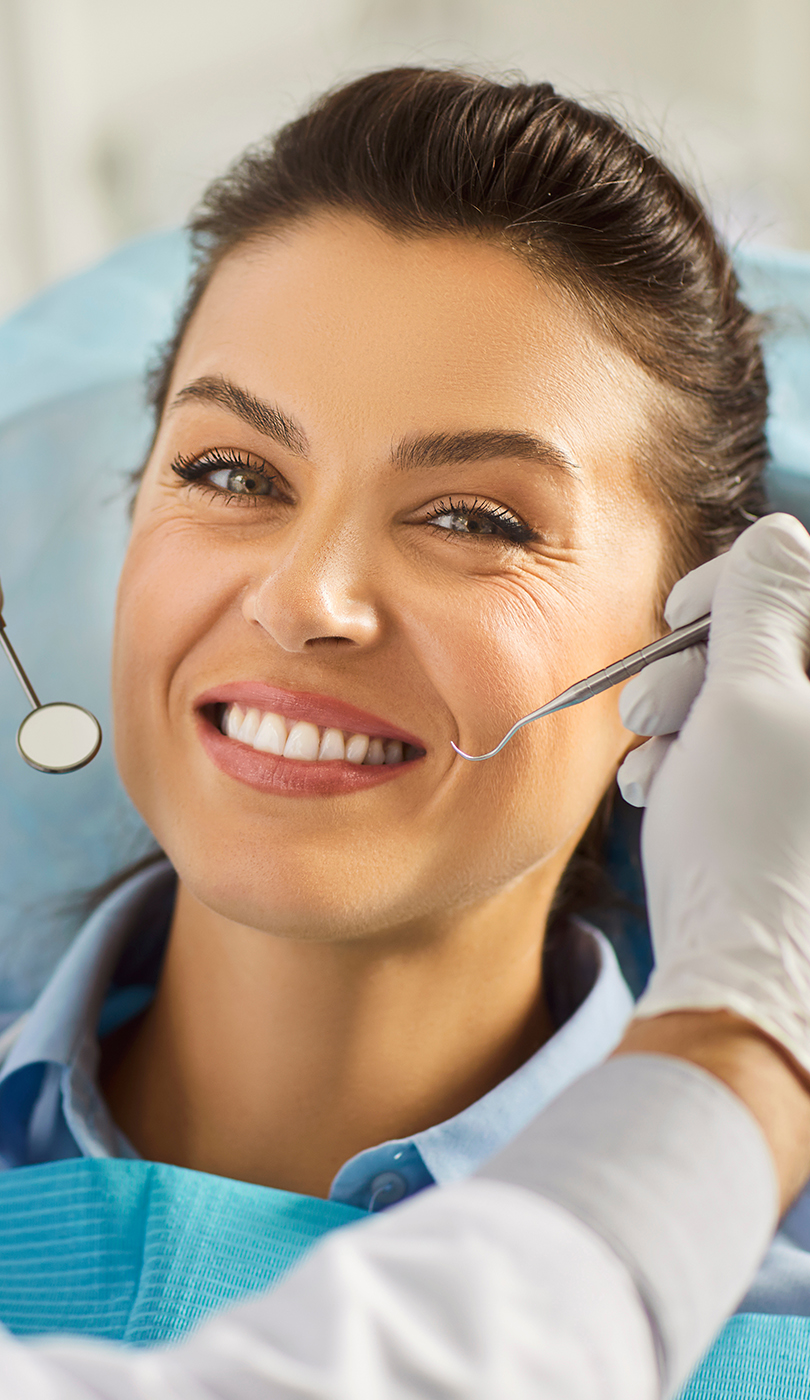 The image shows a modern dental or medical office interior with a dental chair, equipment, and a clean, professional environment.